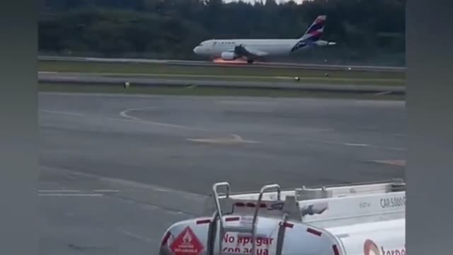 Sparks fly from plane as it makes emergency landing in Colombia