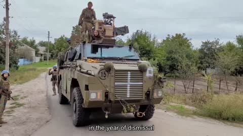 Paratroopers of 80 dshb on Australian armored personnel carriers "Bushmaster" in the liberated vill