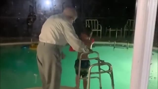 Great grandfather held on to the walker and kicked his great grandson standing b