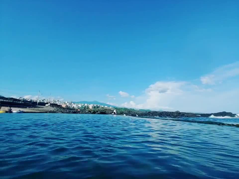 The gentle waves are swaying in the sea.