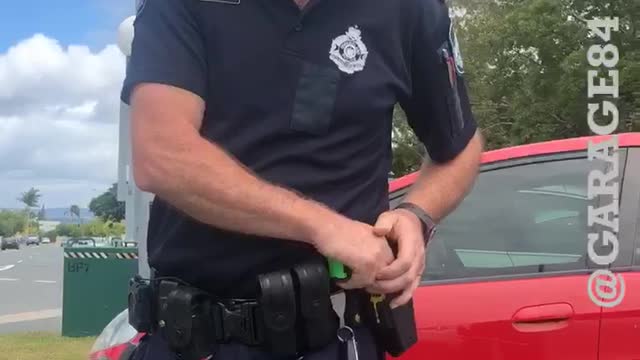 Perturbed Police Man Doesn't Like Driver's Phone