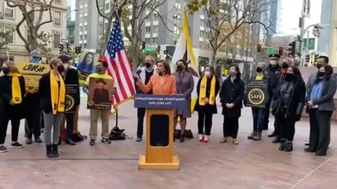 Protestor interrupts Pelosi while giving a speech.