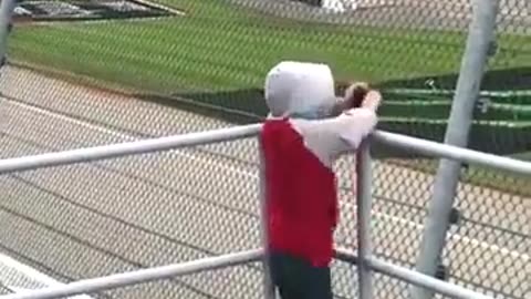 Child encountering powerful crosswinds during a NASCAR event.