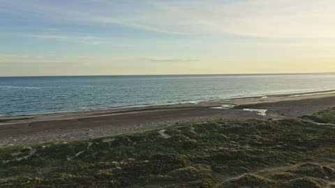 Done flying over an empty beach