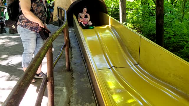 Mom and baby enjoying a slide