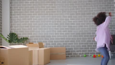 Little African-American Girl Dancing In The Living Room