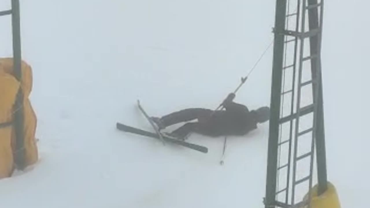 Skier Gets Slowly Dragged By Ski Lift