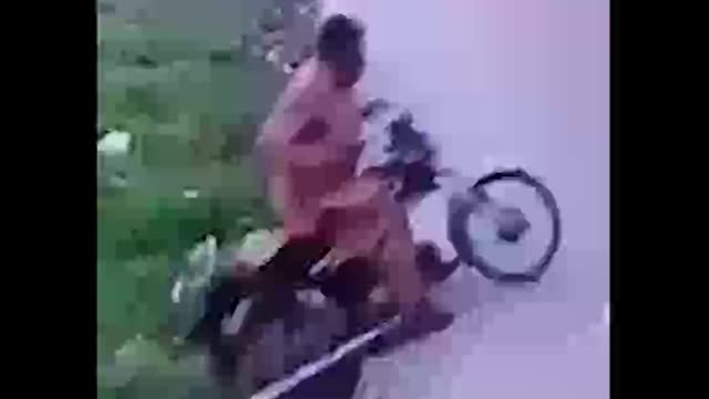 Biker Goes Down the Drain