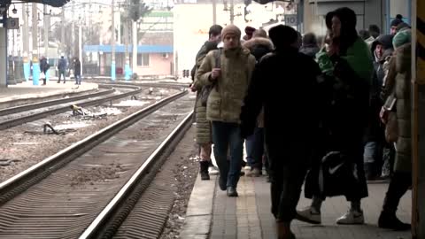 Fleeing women, children crowd Kyiv train station