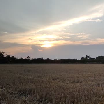 A sunset behind the clouds