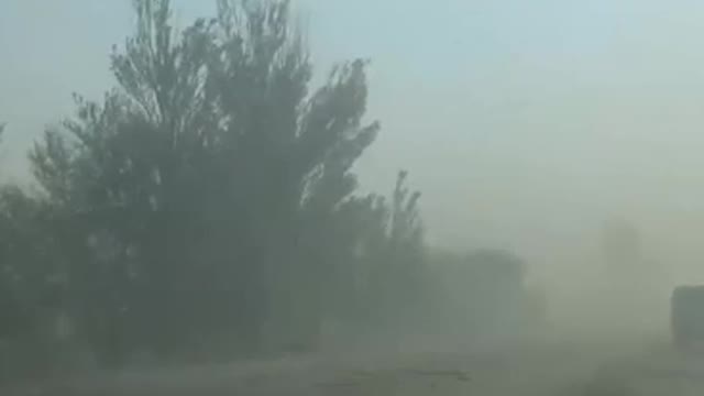 To get to Mariupol, drivers have to break through the dense smog