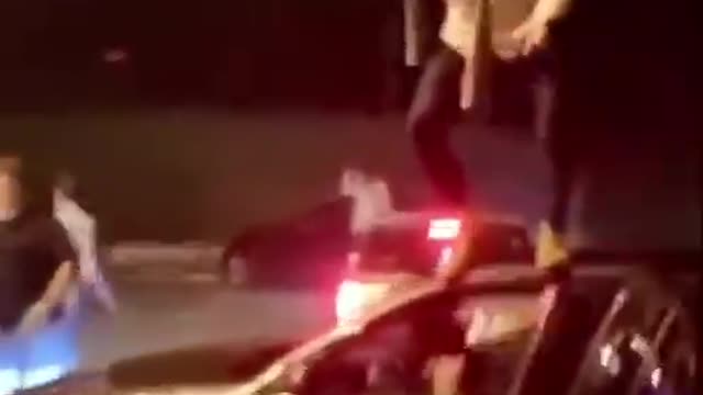 Crazy guy Jumps Off Car