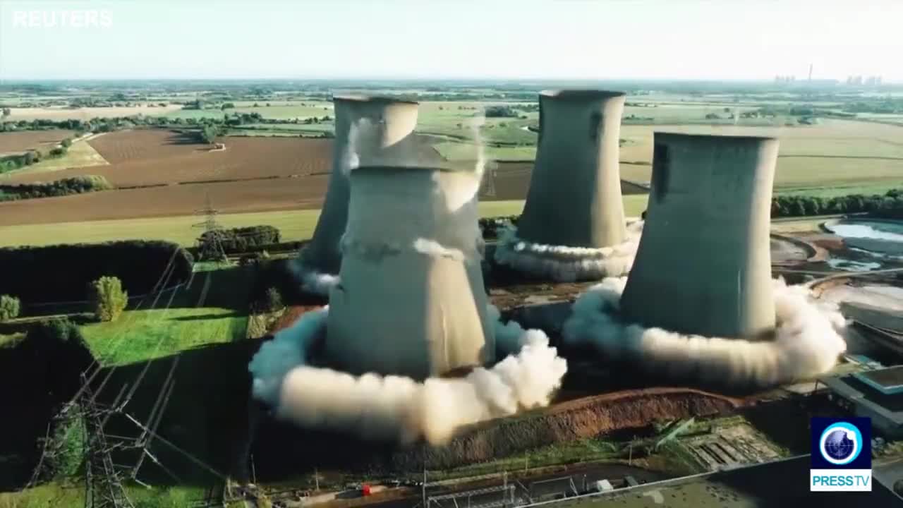 UK power station cooling towers demolished in dramatic implosion