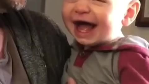 cute baby trying to do bit boxing like his father