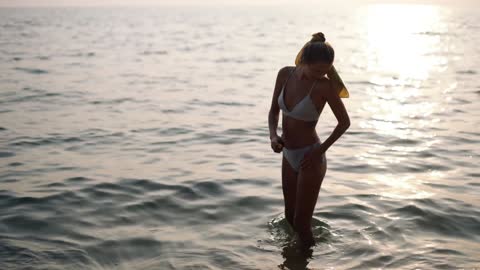 A woman applying sunscreen