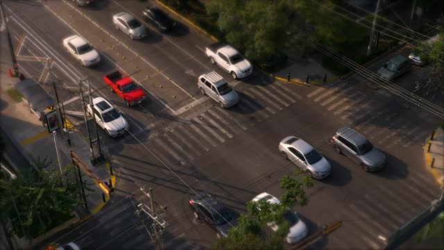 Overhead Time Lapse Footage Of A Busy Street In A City At Daytime