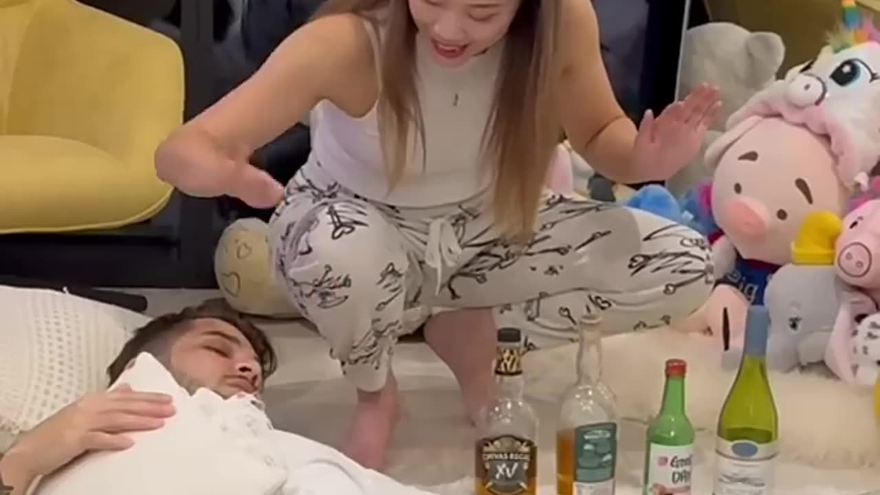 A funny girlfriend pranking her sleeping boyfriend and dad like the boyfriend is drunk