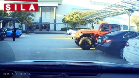 Woman shoved by car while attempting to hold mall parking spot