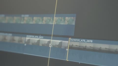 A video cutting process is shown on screen