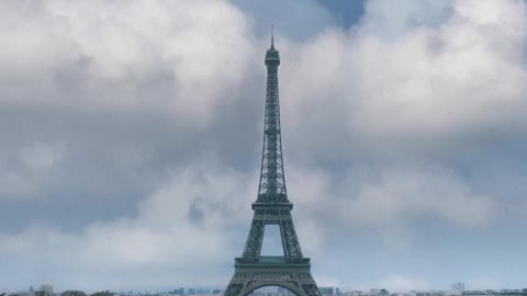 On a Sunny day, Eiffel Tower with a moving Clouds