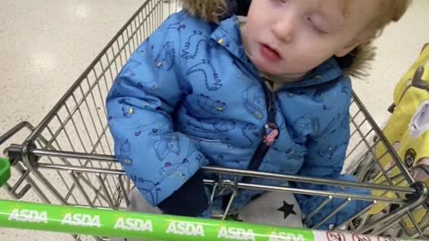 Kid Can't Stay Awake in Shopping Cart