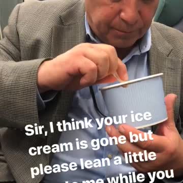 Man in suit eating ice cream