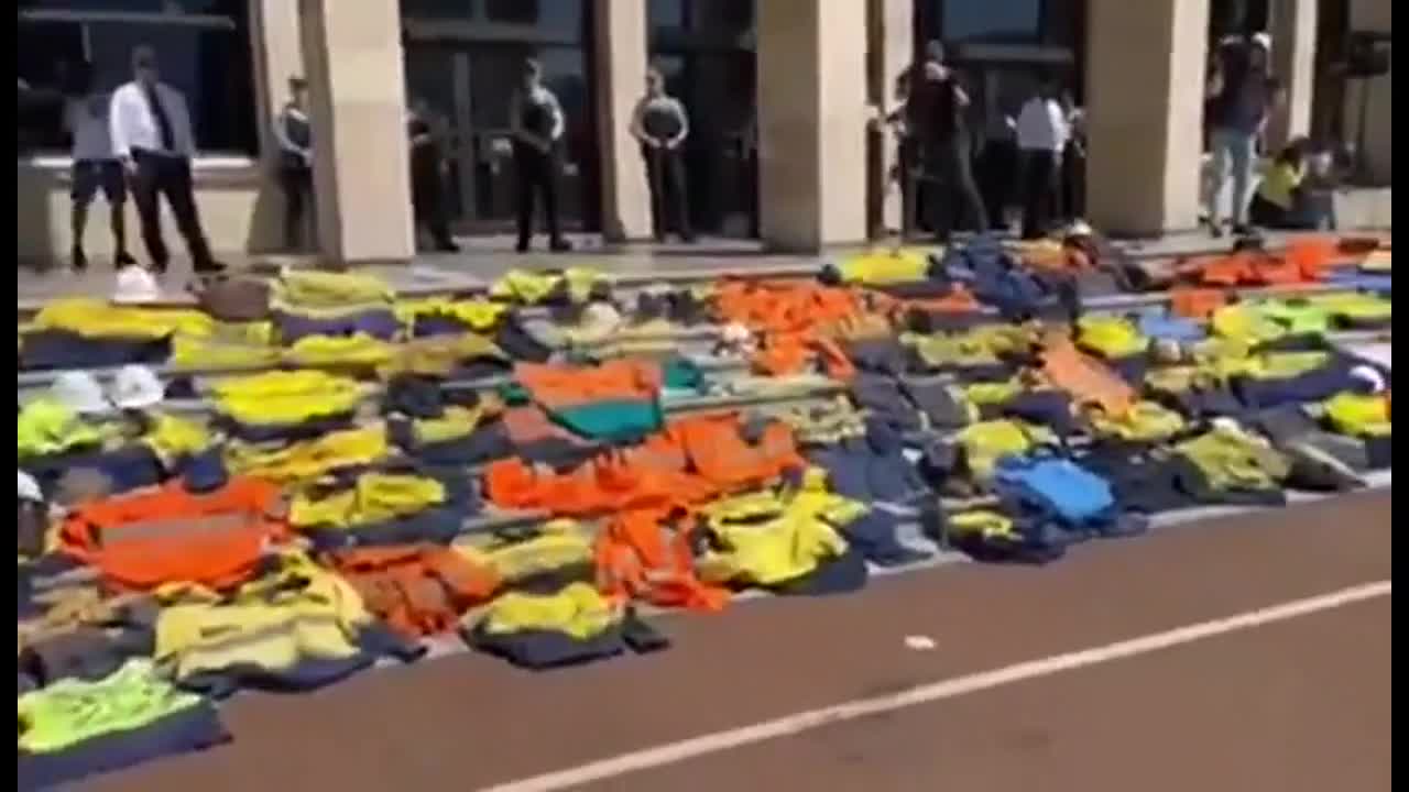 Australia Police, doctors, nurses put on their uniforms in front of Parliament.