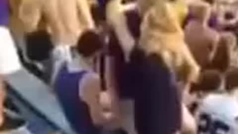 Passionate Kiss Leads To Couple Falling Down Bleachers At Football Game | Funny Videos