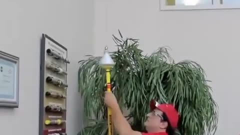 The video shows a thing for replacing light bulbs.