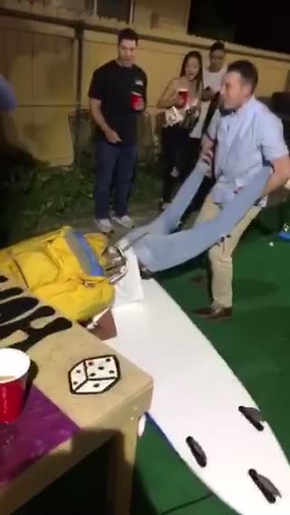 Four guys play chicken on each others shoulders