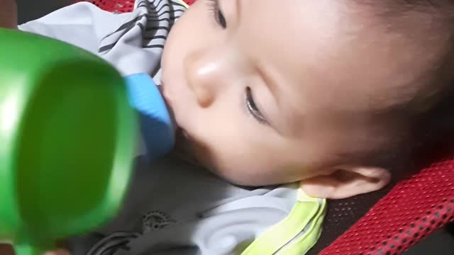 Cute baby drinking milk