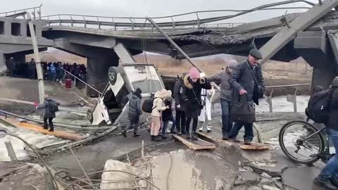 The evacuation from Irpin continues. This is how it looks across the destroyed bridge now.