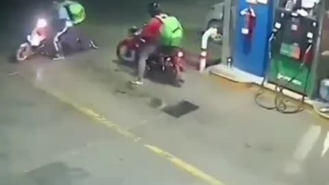 Drunk bike dancing at petrolpump