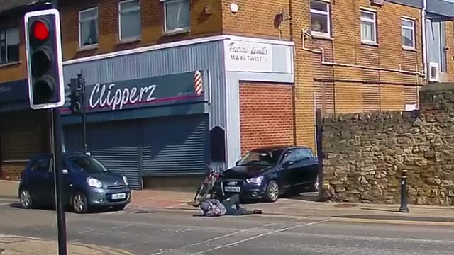 Biker Tumbles Over Bonnet