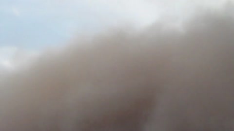 Sandstorm wave rolls in and devours homes