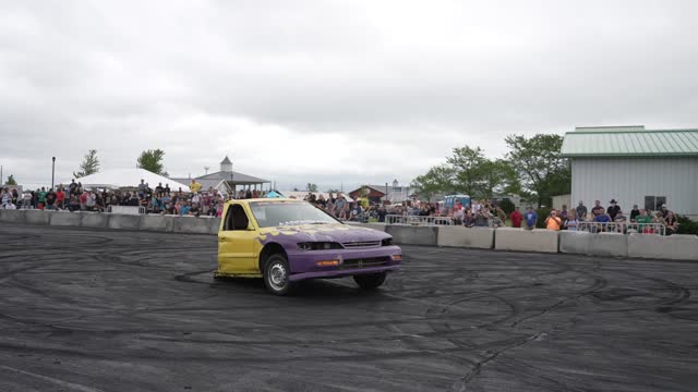 Front half of a car doing burnouts.