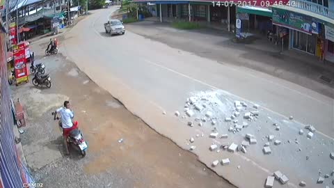 Lucky Motorcyclists Escape Bricks Falling from Truck