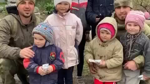 Ukrainian childern greeting Chechen soldiers