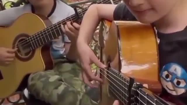 The children play the guitar