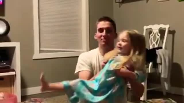 Dad drops daughter while distracted by the game