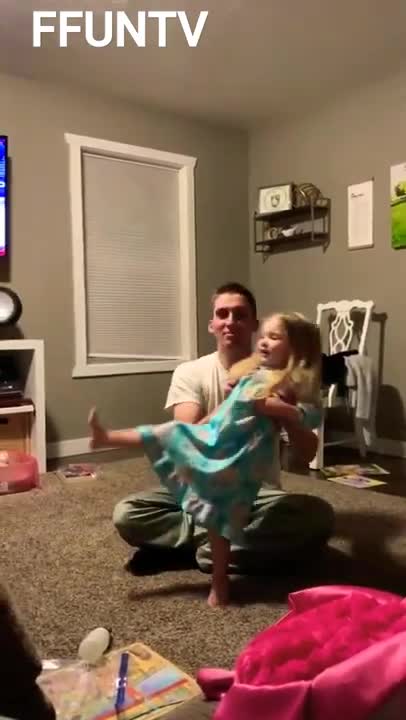 Dad drops daughter while distracted by the game