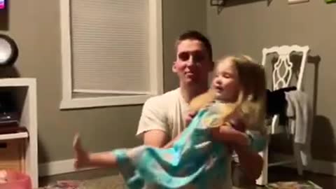 Dad drops daughter while distracted by the game
