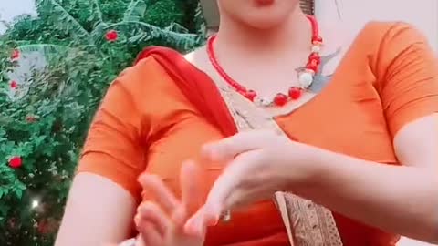 Indian girl singging song with Orange dresses