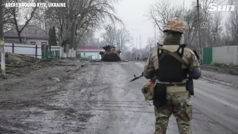 Ukrainian soldiers survey areas liberated from Russian forces outside Kyiv