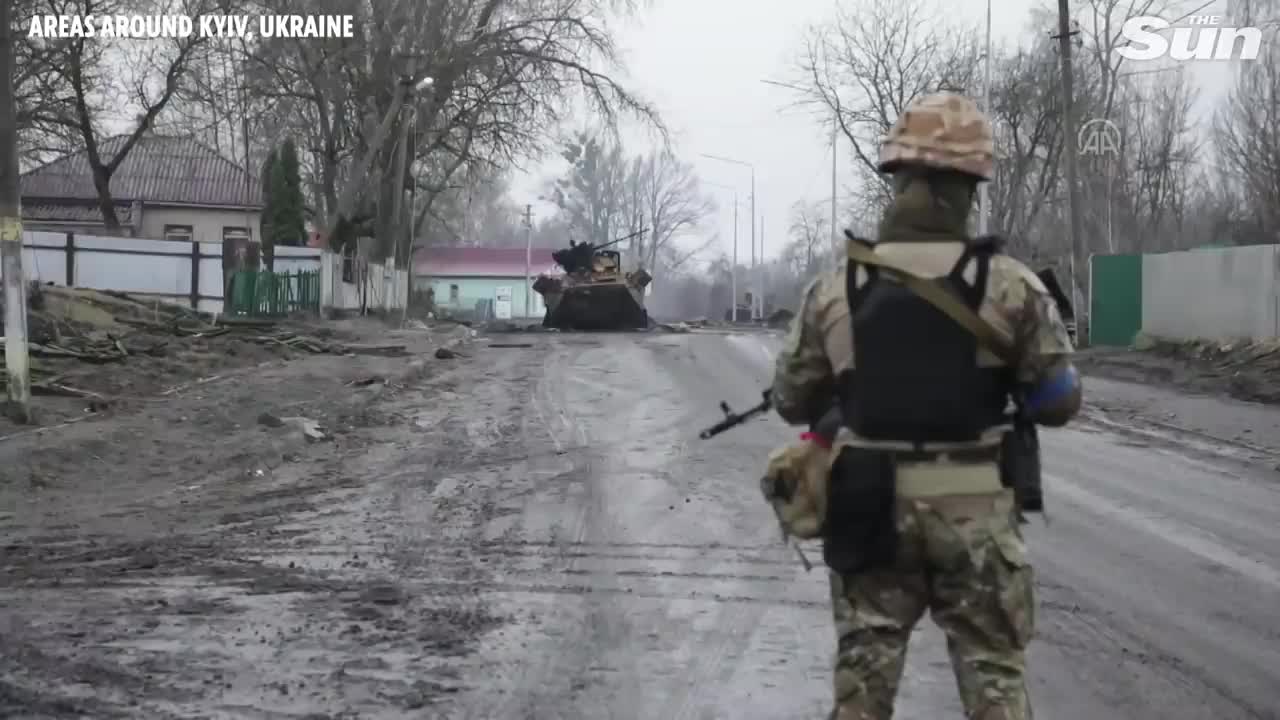 Ukrainian soldiers survey areas liberated from Russian forces outside Kyiv