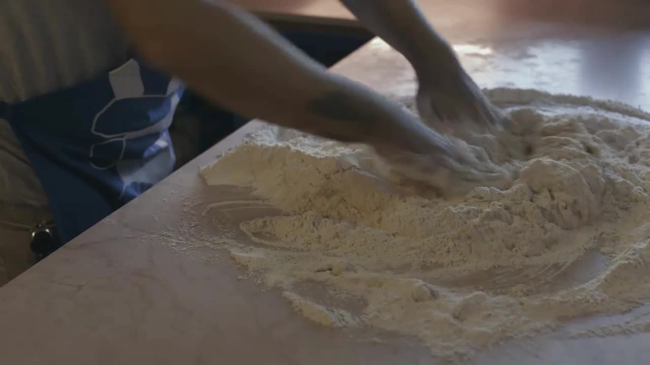 Cook mixing flour for a dough