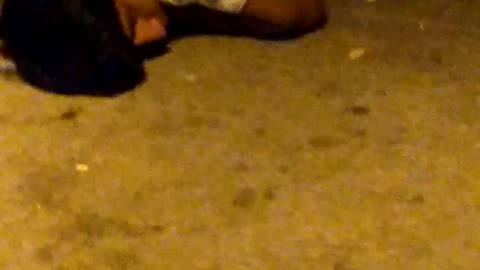 Guy white shirt laying on ground drunk