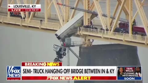 🚨 Semi- truck hanging off bridge between IN and KY