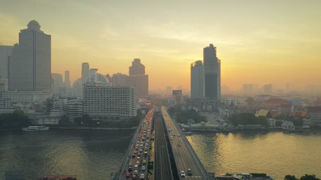 Drone shot flying along Taksin Bridge