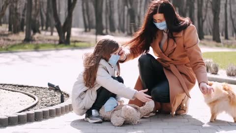 ter with Face Masks at the Park With Dog